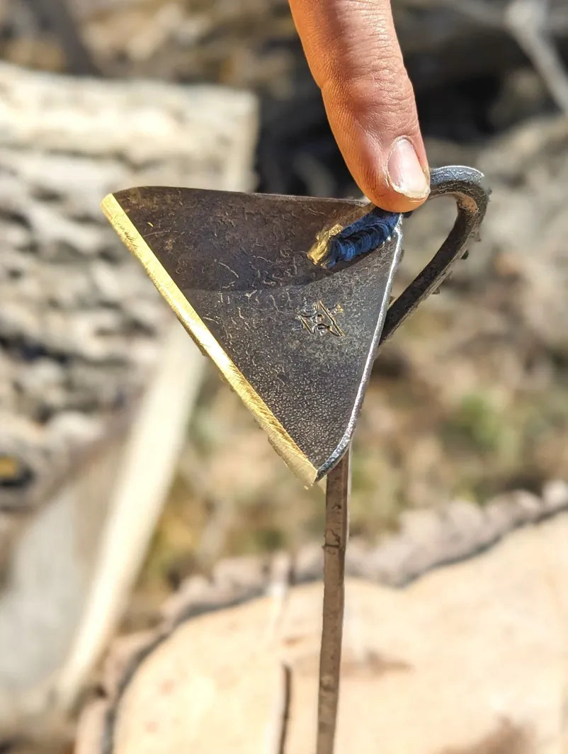 Classic Hoe Hand Forged Garden Tool standing upright finger holding. 