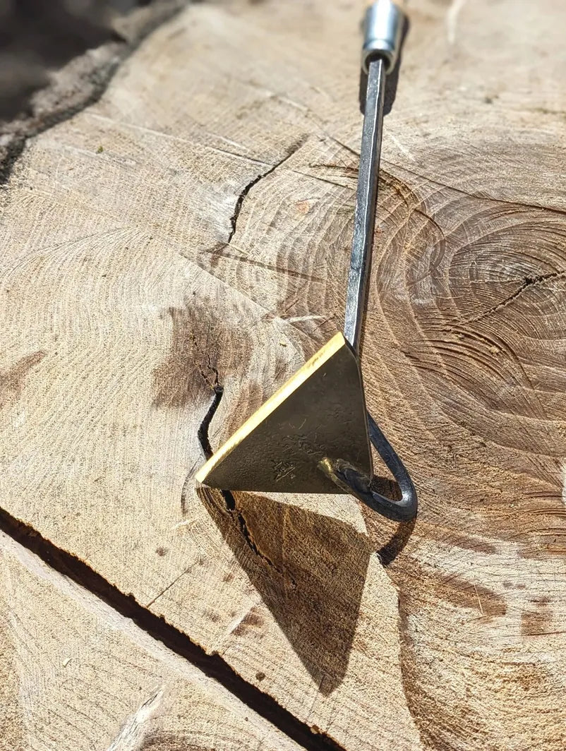 Classic Hoe Hand Forged Garden Tool laying on side with sharp tool head. 