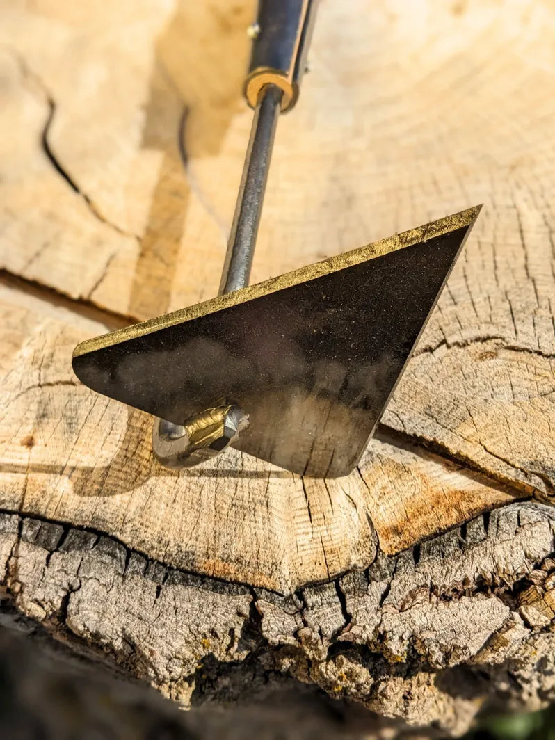V-Hoe Aggressive Long Handled Hand Forged Hoe Homestead Iron focus on tool head. 
